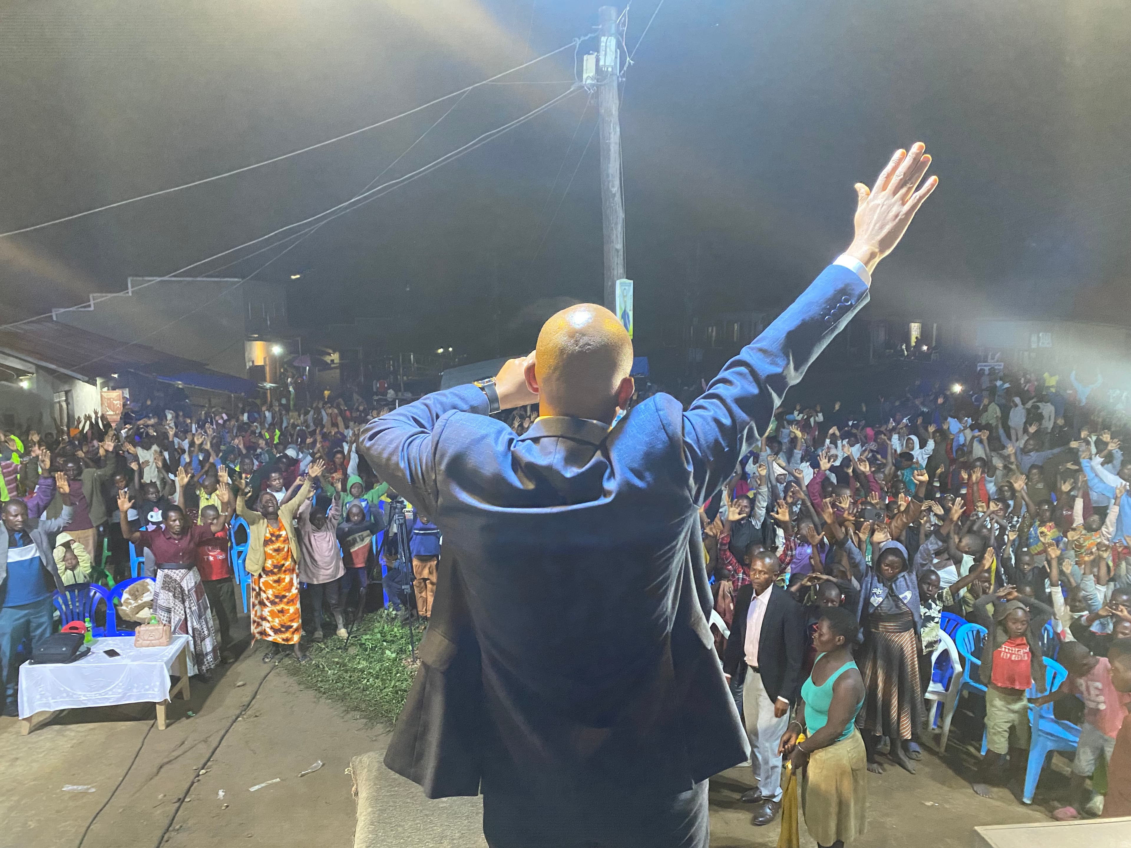 Pastor Gerald praying for the Congregation