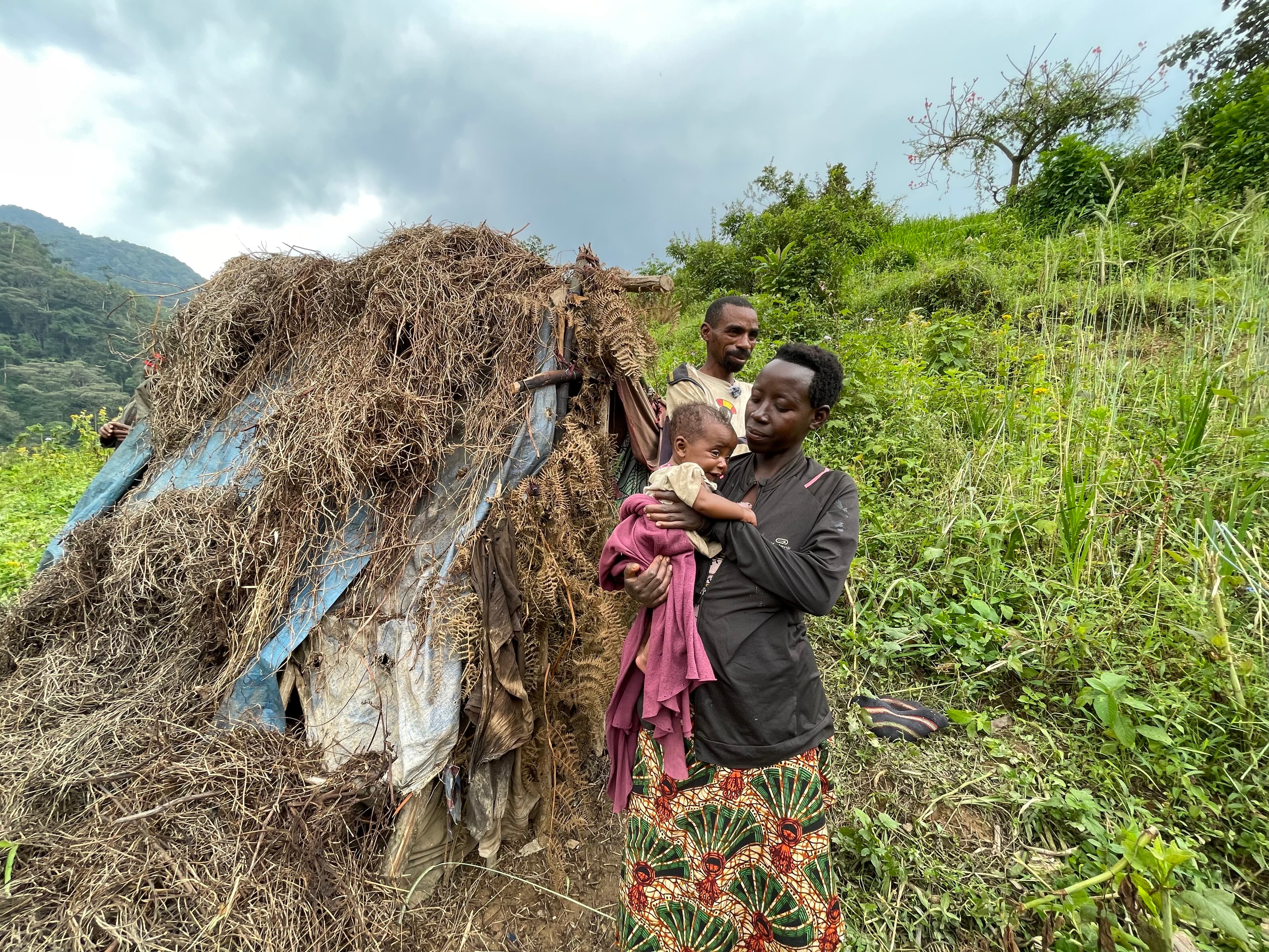 The batwa infront of their house
